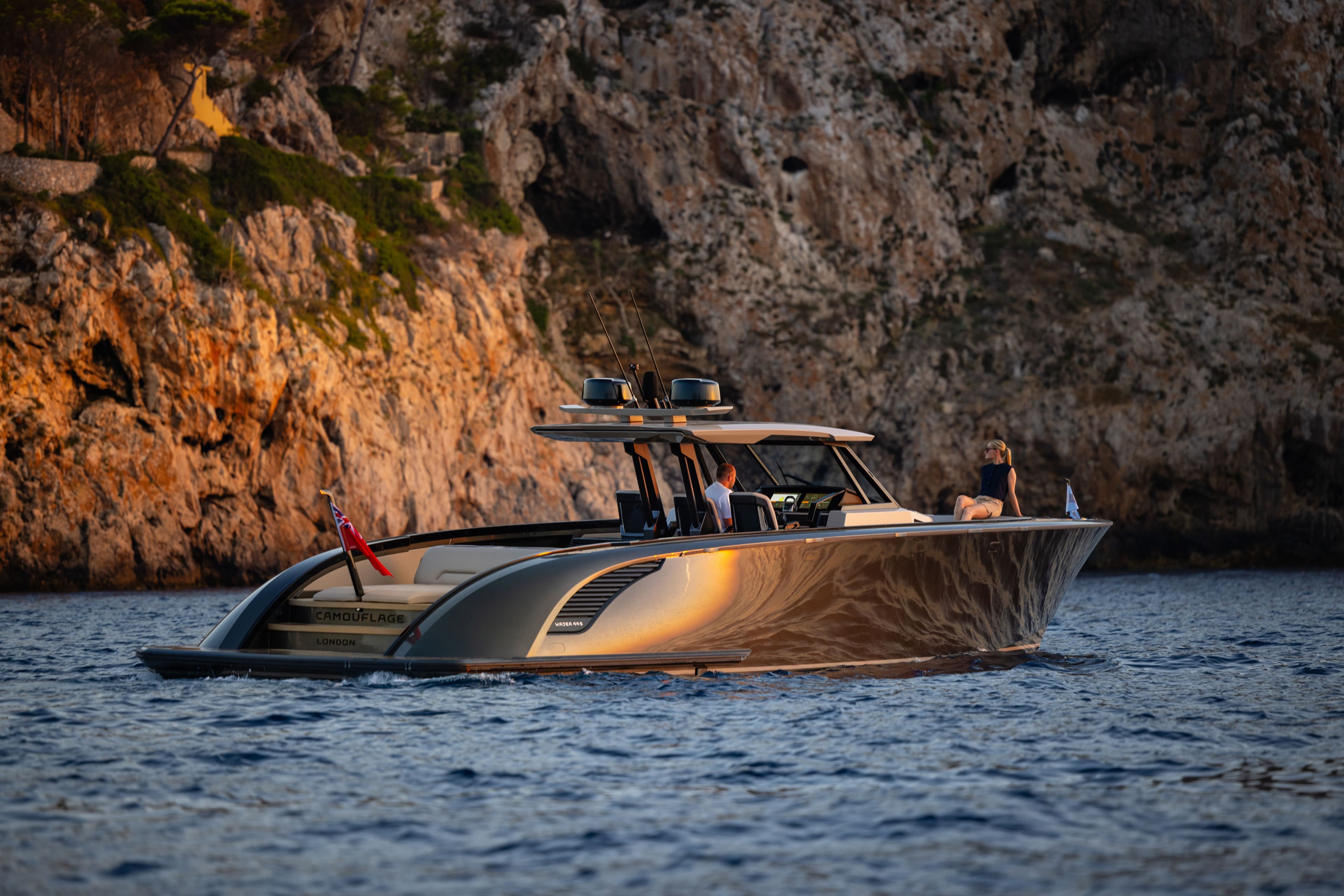 Wajer 44 S camouflage bay still water girl on bow deck